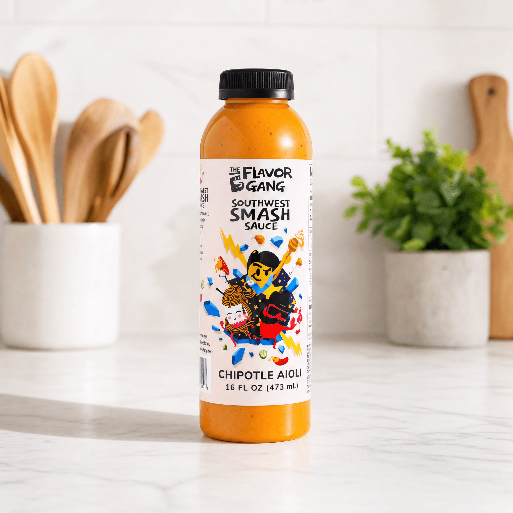 The Flavor Gang Southwest Smash Sauce chipotle aioli in a 16 fl oz bottle on a marble kitchen counter.