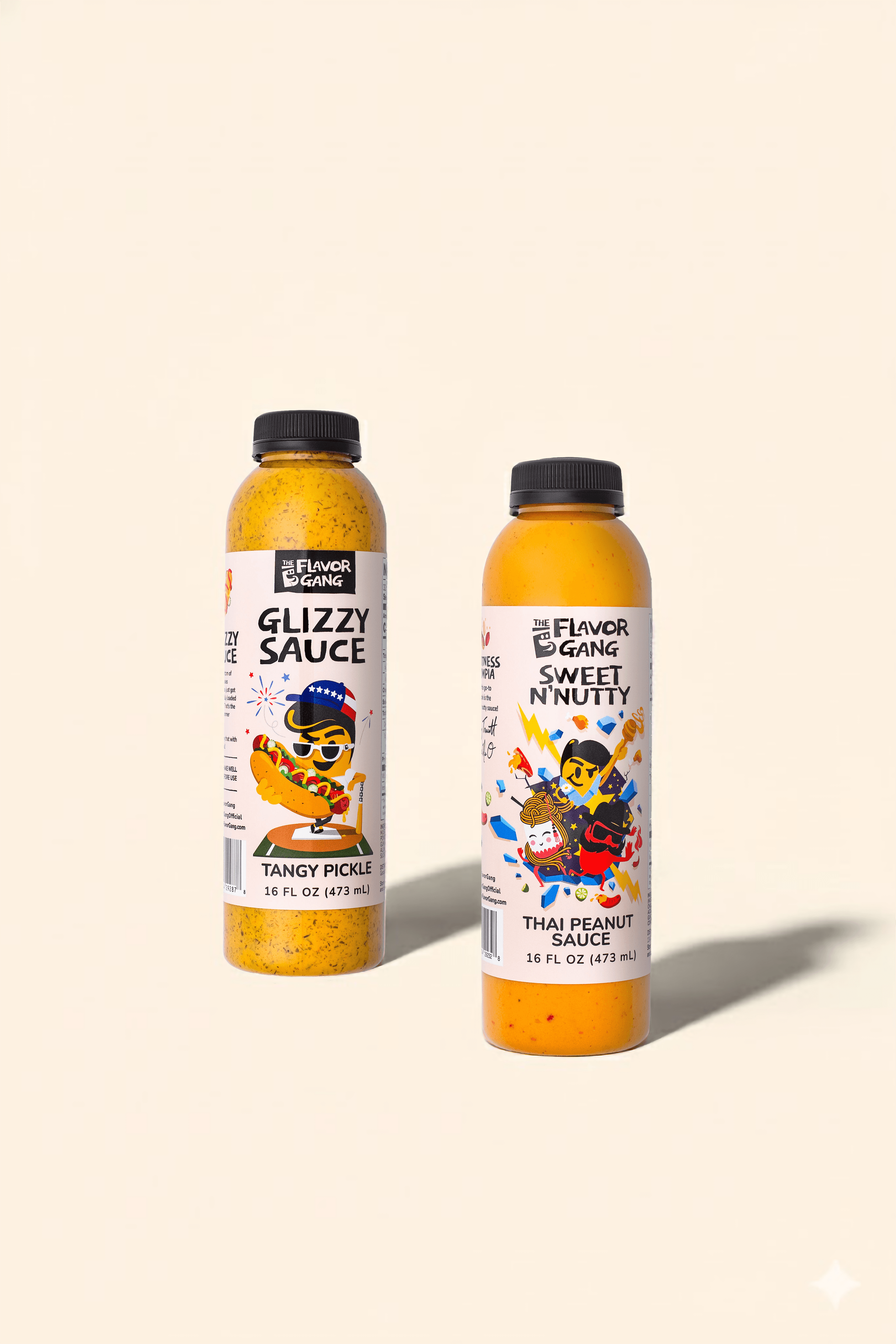 Two bottles of The Flavor Gang sauce on a light cream background: Glizzy Sauce Tangy Pickle on the left and Sweet N’ Nutty Thai Peanut Sauce on the right, both in 16 oz bottles with colorful illustrated labels.
